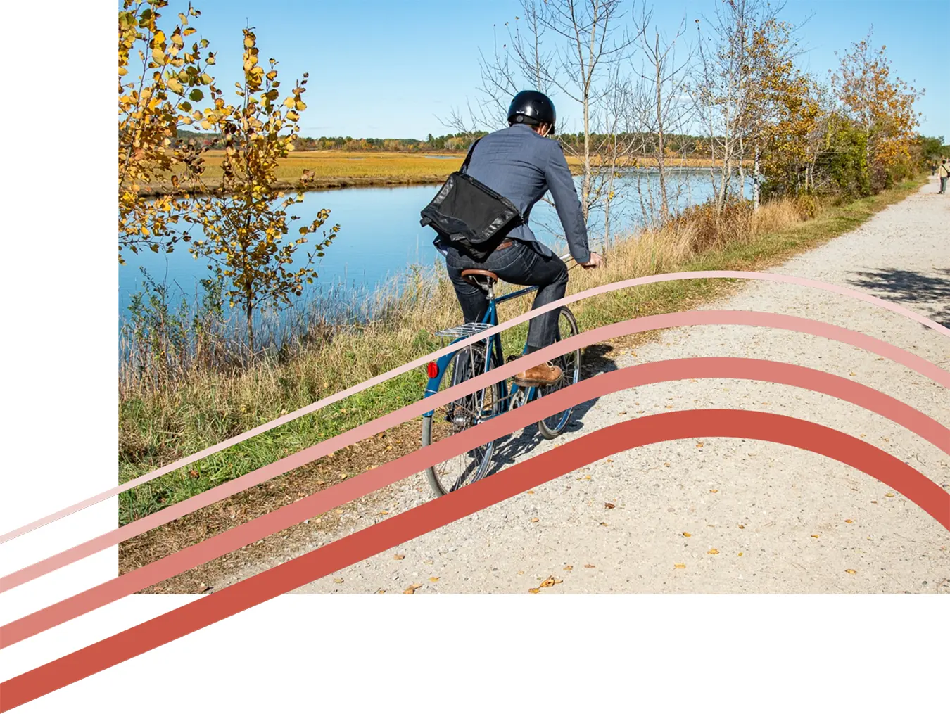man biking along river