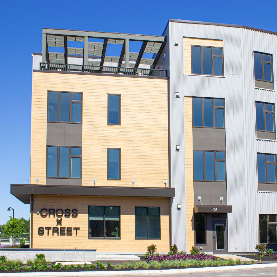 The Cross Street Condos building and rooftop deck space